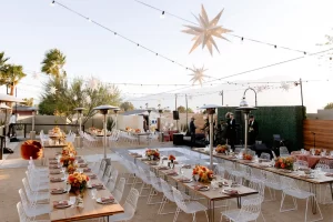 Desert reception with market lights and illuminated star decor at Lautner Palm Springs wedding lighting setup