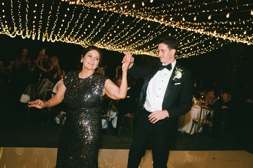 Montage Laguna Beach wedding lighting with dense twinkle canopy creating warm glowing dance floor atmosphere at night