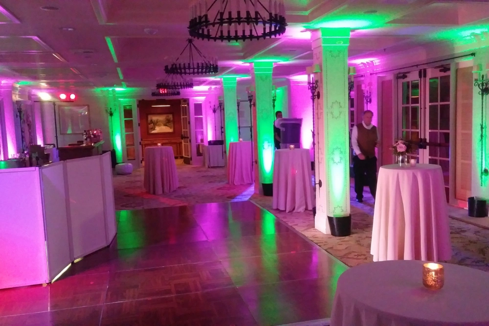 Rancho Valencia wedding lighting with colorful uplighting and elegant indoor reception space in San Diego