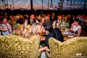 Inn at Rancho Santa Fe wedding lighting with string lights and warm candlelit reception during sunset in San Diego