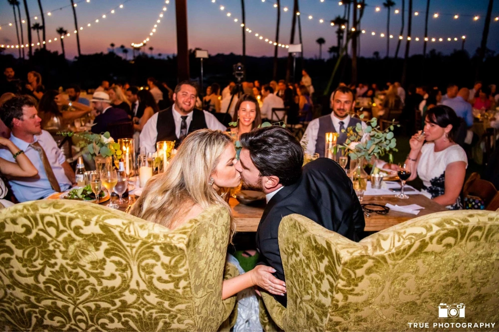 Inn at Rancho Santa Fe wedding lighting with string lights and warm candlelit reception during sunset in San Diego
